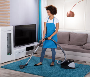 woman doing vacuum cleaning